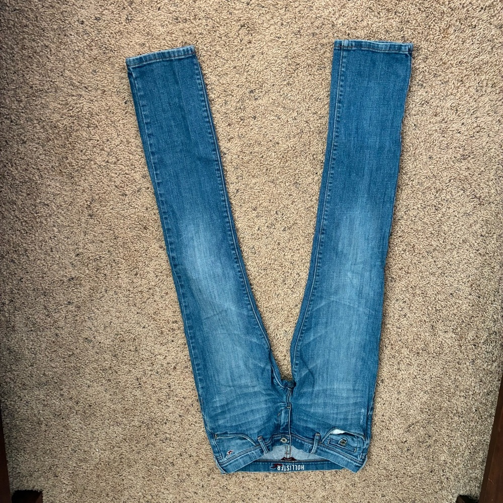 Hollister Light Blue Denim Jeans with Red Logo Accent